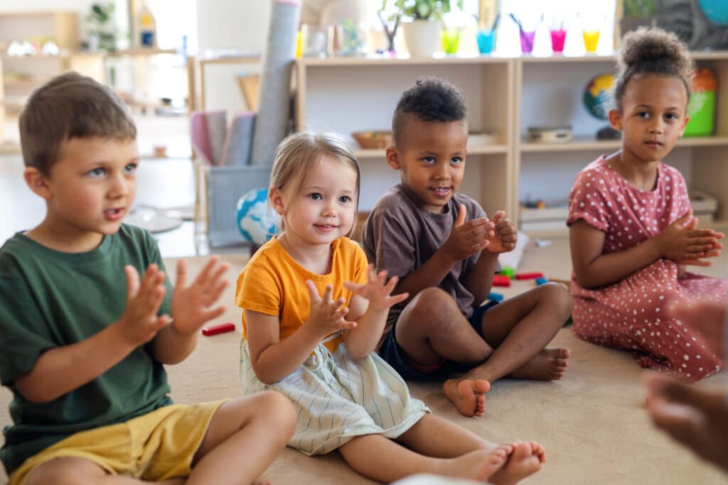 A group of preschool aged children in a circle. Child care expenses